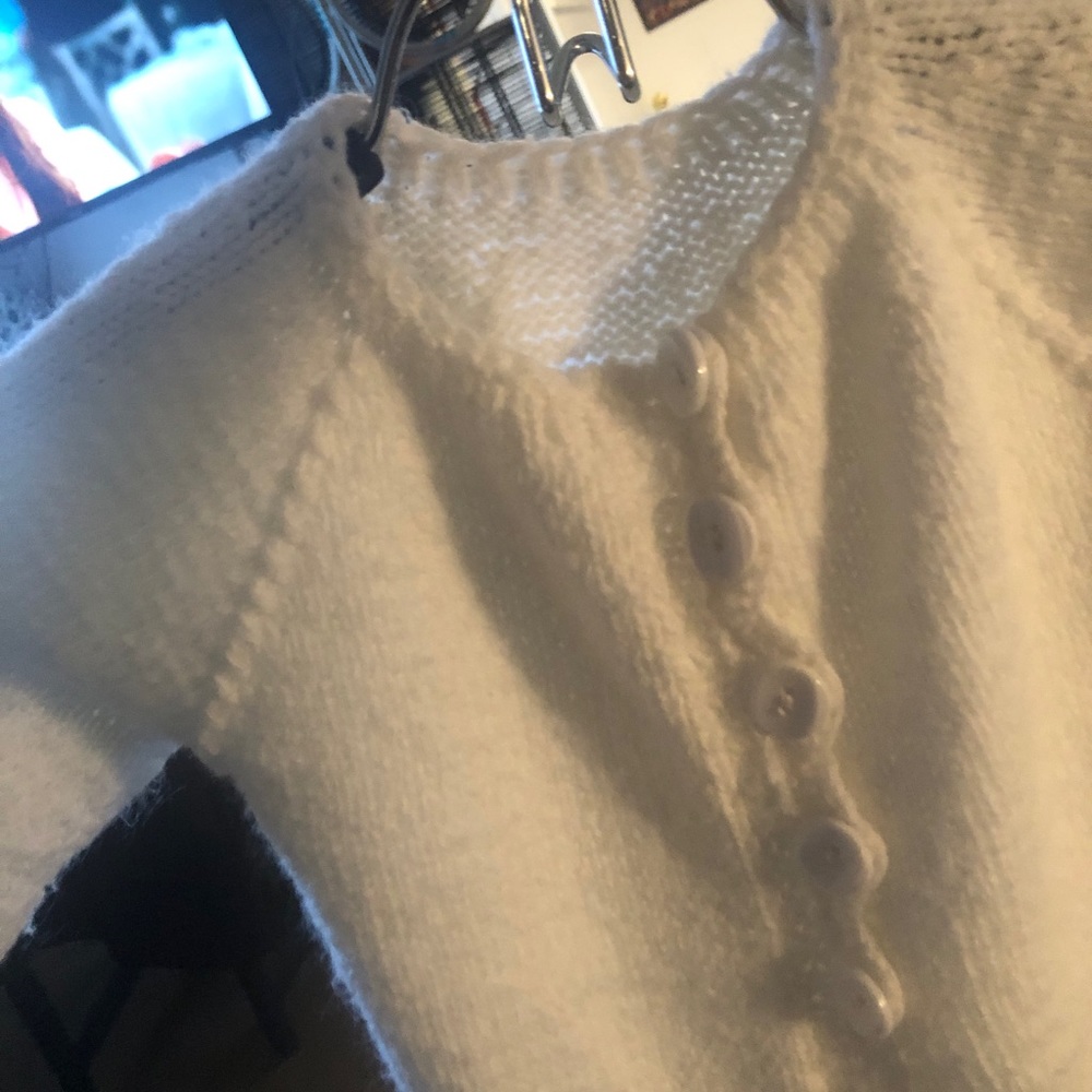 Hand knitted white sweater coat with button closure